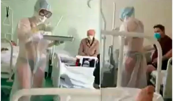 No combate ao coronavírus, enfermeira 'calorosa' mostra demais em hospital e é afastada