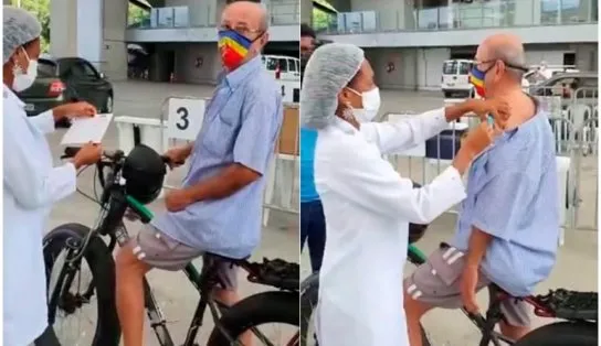 De bicicleta, idoso vai a posto da Arena Fonte Nova e comemora vacinação; assista