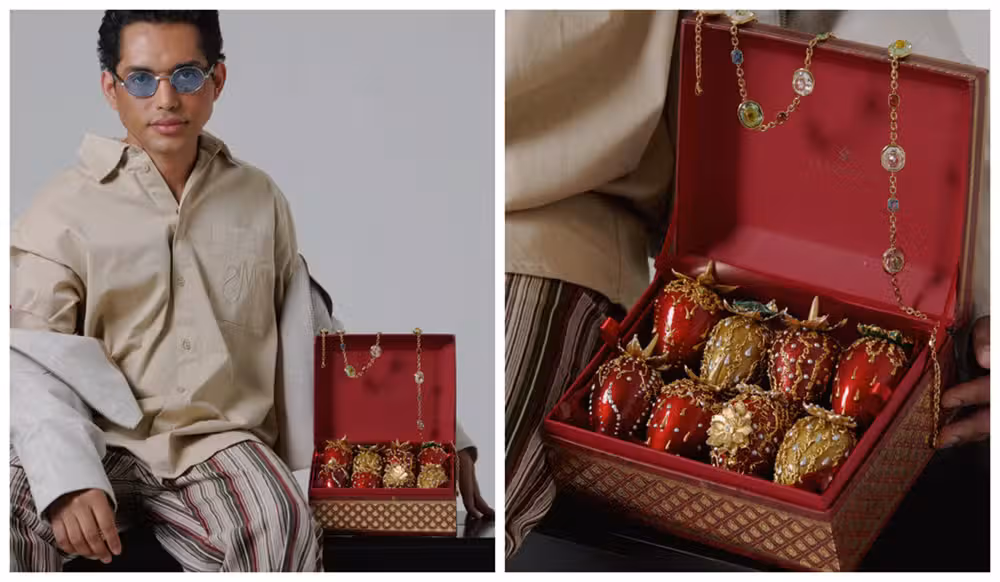Artista plástico Denilson Silva posa com sua edição de luxo de morango do amor. Foto: Iude